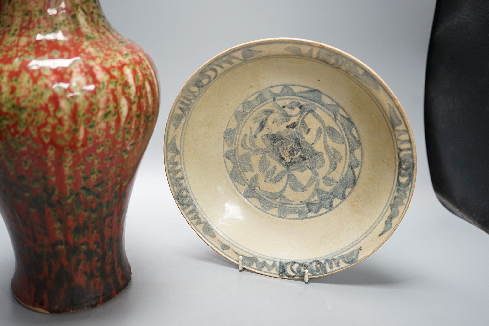 A Chinese flambe vase and two Ming dishes, vase 36cm